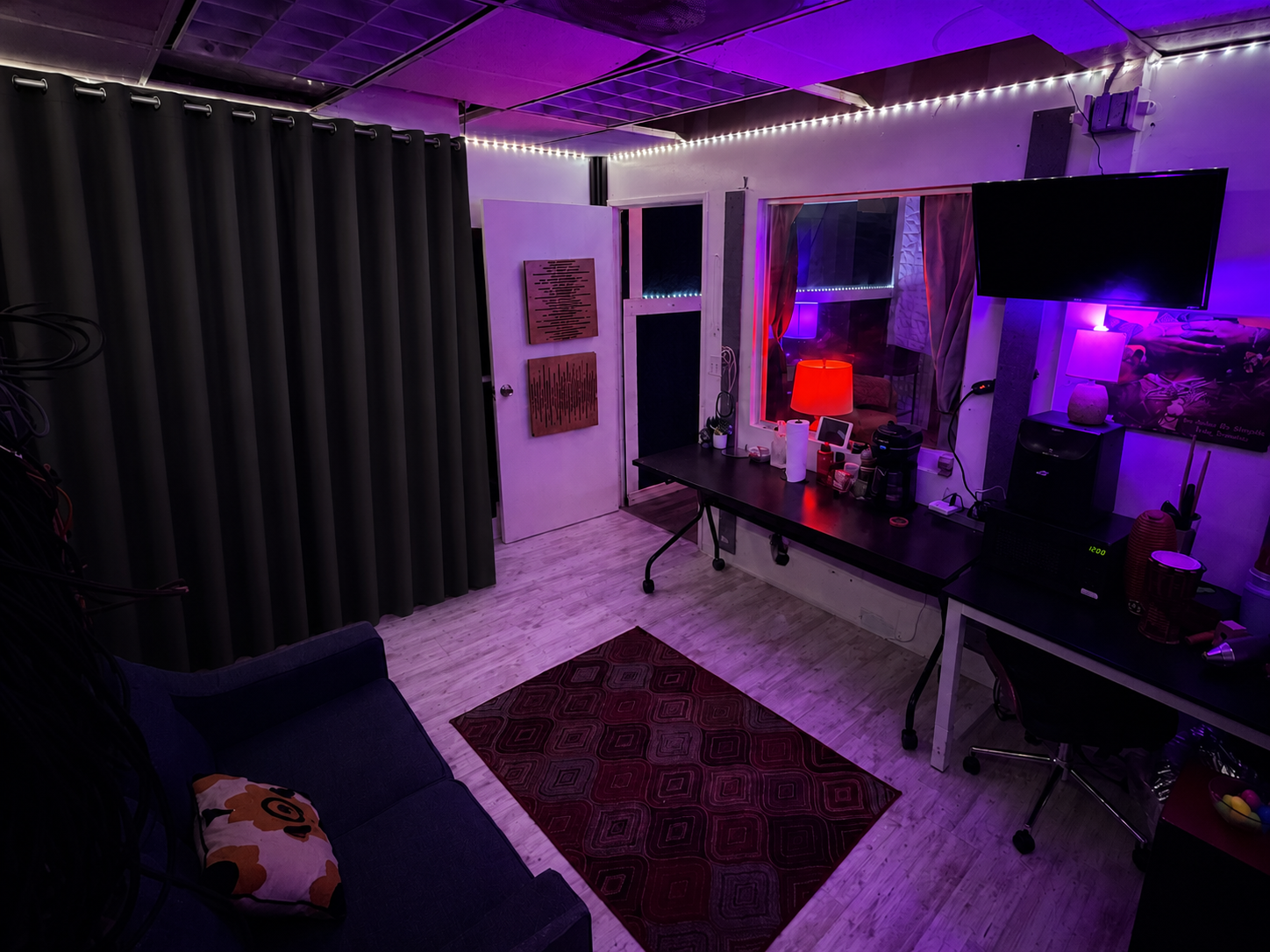 Wide view of the Chokobeats studio workspace with purple lighting
